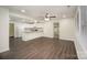 Open-concept living room with new hardwood floors offering seamless flow to the updated kitchen at 8624 Sharonbrook Dr, Charlotte, NC 28210