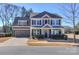 Charming two-story home with attached garage and well-manicured front yard at 8906 Cantrell Way, Huntersville, NC 28078