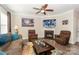 Inviting living room with hardwood floors, fireplace, comfortable seating and ample light at 8906 Cantrell Way, Huntersville, NC 28078