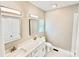 A spacious bathroom with double vanity, a large mirror, and modern finishes at 926 Poplar St, Albemarle, NC 28001