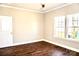 This spacious bedroom features hardwood floors and natural light from two windows at 926 Poplar St, Albemarle, NC 28001