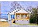 Charming cottage-style home with a cozy front porch and fresh paint at 926 Poplar St, Albemarle, NC 28001