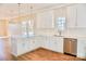 Well-equipped kitchen with stainless steel appliances, white cabinets and granite countertops at 926 Poplar St, Albemarle, NC 28001