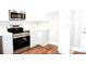 Kitchen features new stainless steel oven, microwave and cabinets at 926 Poplar St, Albemarle, NC 28001