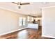 Open-concept living space with hardwood floors, a ceiling fan and lots of natural light at 926 Poplar St, Albemarle, NC 28001