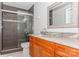 Modern bathroom features glass enclosed shower, updated fixtures, and a granite countertop at 100 Willow Run Dr, Gastonia, NC 28056