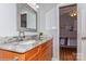 Bathroom featuring vanity with granite top, modern faucet and mirror at 100 Willow Run Dr, Gastonia, NC 28056