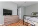 Bedroom featuring hardwood floors, closet and dresser at 100 Willow Run Dr, Gastonia, NC 28056