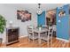Dining area with a wine fridge, stylish light fixture, and seating for four at 100 Willow Run Dr, Gastonia, NC 28056