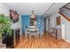 Dining area with a wine fridge, stylish light fixture, and access to front entry and stairwell at 100 Willow Run Dr, Gastonia, NC 28056