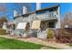 Two-story townhome featuring private balconies, covered patios, and gray siding at 100 Willow Run Dr, Gastonia, NC 28056
