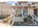 Townhome exterior with cozy front porch and stairs at 100 Willow Run Dr, Gastonia, NC 28056