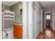 Hallway view of bathroom and closet space at 100 Willow Run Dr, Gastonia, NC 28056