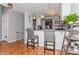 Modern kitchen with hardwood floors and gray barstools at 100 Willow Run Dr, Gastonia, NC 28056
