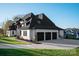 Attractive angle view showing the three car garage and white painted brick at 1004 Maxwell Ct # 1, Marvin, NC 28173