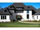 Charming two-story home showcasing black frame windows and a landscaped yard at 1004 Maxwell Ct # 1, Marvin, NC 28173