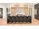 Open kitchen design with island seating, marble countertops, and hardwood floors at 1004 Maxwell Ct # 1, Marvin, NC 28173