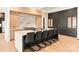 Bright kitchen featuring an island with seating, stainless steel appliances, and black cabinets at 1004 Maxwell Ct # 1, Marvin, NC 28173