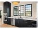 Contemporary kitchen featuring dark cabinetry, stainless steel appliances, and modern finishes at 1004 Maxwell Ct # 1, Marvin, NC 28173