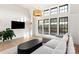 Modern living room featuring high ceilings, many windows, and neutral colors at 1004 Maxwell Ct # 1, Marvin, NC 28173