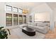 Bright living room featuring high ceilings, many windows, neutral colors, and open floorplan at 1004 Maxwell Ct # 1, Marvin, NC 28173
