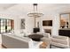 Spacious living room featuring an elegant fire place and a modern chandelier at 1004 Maxwell Ct # 1, Marvin, NC 28173