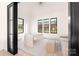 Bright office space featuring three large windows, neutral color scheme, and modern decor at 1004 Maxwell Ct # 1, Marvin, NC 28173