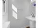 Bathroom with a white pedestal sink, new mirror, and modern fixtures at 1188 Parkmont Ln, Rock Hill, SC 29730
