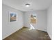 Bright bedroom with neutral carpet and two windows offering abundant natural light at 1188 Parkmont Ln, Rock Hill, SC 29730