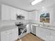 Updated kitchen with white cabinets, modern appliances, and laminate countertops at 1188 Parkmont Ln, Rock Hill, SC 29730