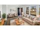 Staged living room showcasing neutral decor, lots of natural light, and modern flooring at 1188 Parkmont Ln, Rock Hill, SC 29730