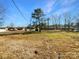 Spacious front yard with mature trees, providing plenty of room for outdoor activities at 1188 Parkmont Ln, Rock Hill, SC 29730