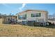 The backyard features a deck with stairs and a covered patio at 120 Dixie Dr, Shelby, NC 28021