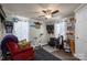 Comfortable bedroom with a ceiling fan, desk area, and a cozy red recliner for relaxation at 120 Dixie Dr, Shelby, NC 28021
