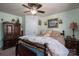 Cozy bedroom with a ceiling fan, a double bed, an antique wardrobe, and bedside tables at 120 Dixie Dr, Shelby, NC 28021