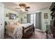 Bright bedroom with a large window, ceiling fan, plush bedding, and ample natural light at 120 Dixie Dr, Shelby, NC 28021