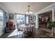 Sunlit dining area featuring an elegant table setting with decorative chairs and a view to the backyard at 120 Dixie Dr, Shelby, NC 28021