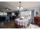 Eat-in kitchen with painted blue cabinets, black appliances, an island and a view of the property at 120 Dixie Dr, Shelby, NC 28021