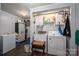 Functional laundry room equipped with a washer, dryer, and plenty of storage space at 120 Dixie Dr, Shelby, NC 28021