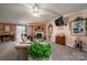Cozy living room with a fireplace, comfortable seating, and a mounted television for relaxing evenings at 120 Dixie Dr, Shelby, NC 28021