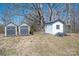 View of outbuildings and sheds on the property. Some with double doors and in neutral colors at 120 Dixie Dr, Shelby, NC 28021