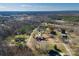 Expansive aerial view of a private property featuring a traditional home, mature trees, and lush landscaping at 133 Persimmon Creek Rd # 81, Kings Mountain, NC 28086
