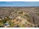 Expansive aerial view of a private property featuring a traditional home, mature trees, and lush landscaping at 133 Persimmon Creek Rd # 81, Kings Mountain, NC 28086
