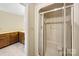 Bright bathroom featuring a glass enclosed stand-up shower and vanity with wooden cabinetry at 133 Persimmon Creek Rd # 81, Kings Mountain, NC 28086