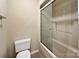 Bathroom with a toilet, shower and partially frosted shower doors at 133 Persimmon Creek Rd # 81, Kings Mountain, NC 28086