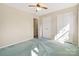 This bedroom has a ceiling fan, double closets, and carpeted floors at 133 Persimmon Creek Rd # 81, Kings Mountain, NC 28086
