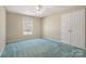 A cozy bedroom featuring carpet, a ceiling fan, window and a closet at 133 Persimmon Creek Rd # 81, Kings Mountain, NC 28086