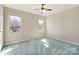 This bedroom features a ceiling fan, and double hung windows offering natural light at 133 Persimmon Creek Rd # 81, Kings Mountain, NC 28086