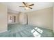 Spacious primary bedroom with a ceiling fan, and carpeted flooring plus a sliding glass door at 133 Persimmon Creek Rd # 81, Kings Mountain, NC 28086