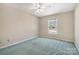 This bedroom features a ceiling fan, double hung window, and carpeted flooring at 133 Persimmon Creek Rd # 81, Kings Mountain, NC 28086